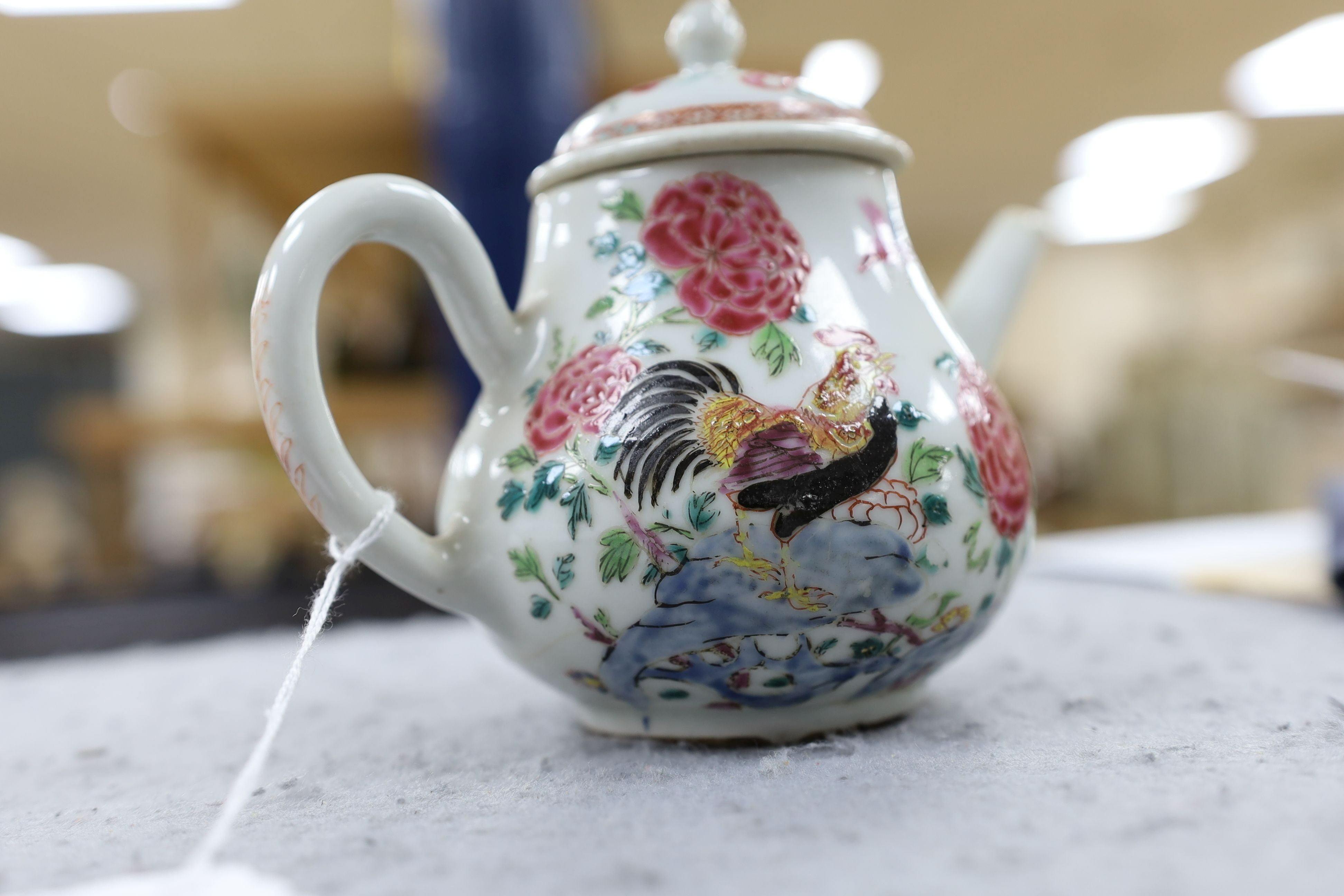 A Chinese famille rose ‘cockerel’ teapot, Yongzheng period, 12 cms high, 11.5cm high
